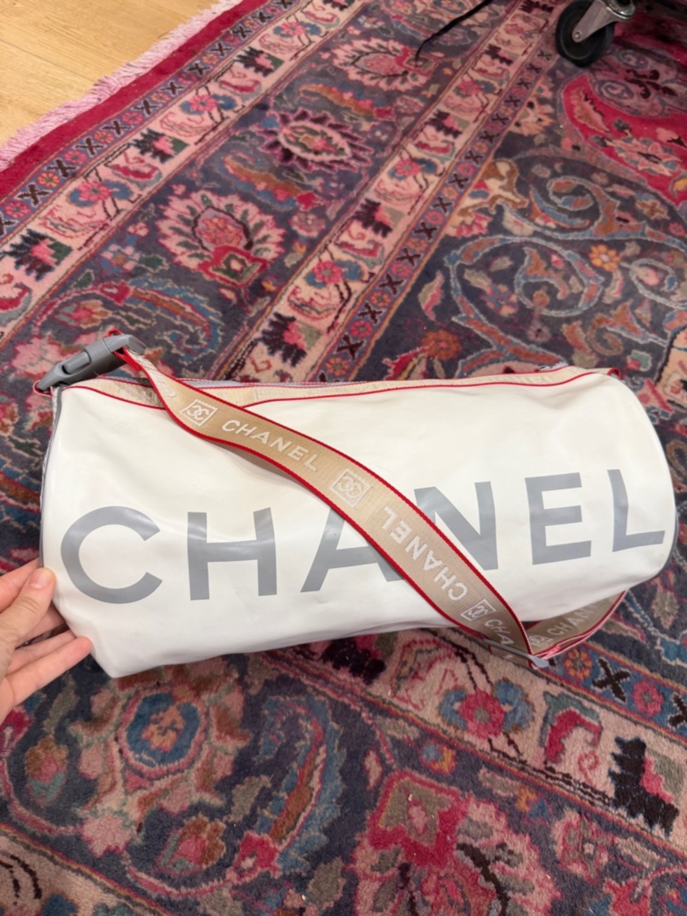 CHANEL White Duffel Bag with Red-Trim Strap